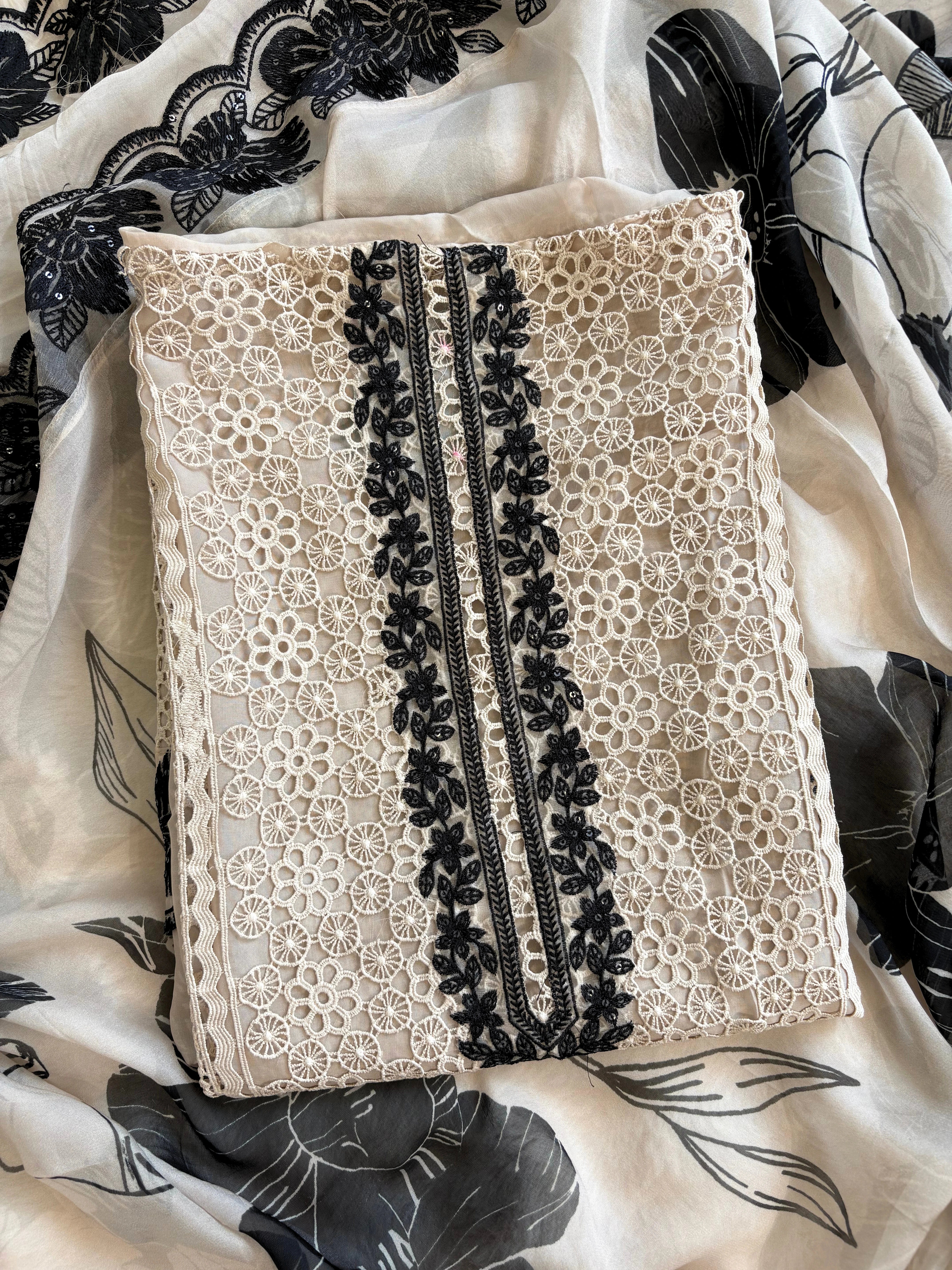 Ivory unstitched cutwork shirt with black applique embroidery and lace detailing, festive ethnic wear fabric